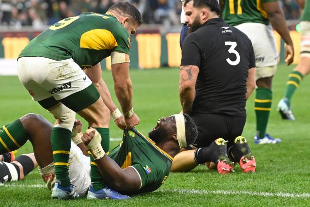 TOPSHOT - South Africa's flanker Siya Kolisi (bottom R) celebrates after scoring a try during the second Rugby's Greatest Rivalry international rugby union match between South Africa and New Zealand at the Cape Town Stadium in Cape Town, on August 29, 2026. (Photo by Rodger Bosch / AFP)