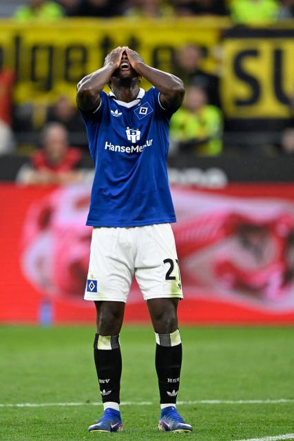 Hamburg's Zambian forward #27 Patson Daka reacts during the German first division Bundesliga football match between BVB Borussia Dortmund and Hamburg SV in Dortmund, western Germany on August 29, 2026. (Photo by INA FASSBENDER / AFP) / DFL REGULATIONS PROHIBIT ANY USE OF PHOTOGRAPHS AS IMAGE SEQUENCES AND/OR QUASI-VIDEO