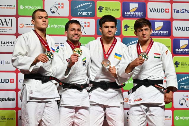 (From L) Silver medallist Russia's Danil Lavrentev, gold medallist Brazil's Daniel Cargnin, bronze medallists Ukraine's Said-Magomed Khalidov and Tajikistan's Muhiddin Asadulloev pose with their medals after the men's under 73kg category final event at the Lausanne Grand Slam judo tournament, as part of the IJF World Judo Tour, in Prilly on August 29, 2026. (Photo by Fabrice COFFRINI / AFP)