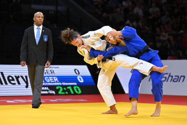 Germany's Miriam Butkereit (white) and Germany's Giovanna Scoccimarro compete in the women's under 70kg gold medal bout at the Lausanne Grand Slam judo tournament, part of the IJF World Judo Tour, in Prilly on August 29, 2026. (Photo by Fabrice COFFRINI / AFP)