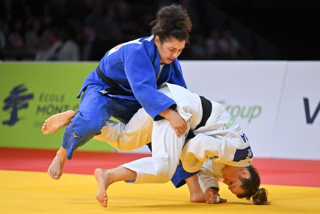 Russia's Madina Taimazova (white) and France's Clemence Eme compete in the women's under 70kg bronze medal bout at the Lausanne Grand Slam judo tournament, part of the IJF World Judo Tour, in Prilly on August 29, 2026. (Photo by Fabrice COFFRINI / AFP)