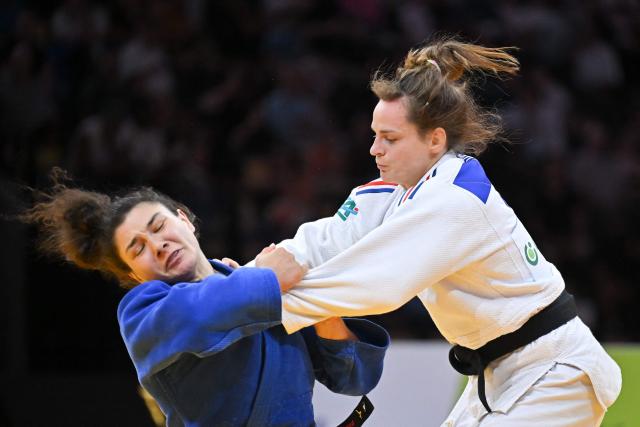 Russia's Madina Taimazova (white) and France's Clemence Eme compete in the women's under 70kg bronze medal bout at the Lausanne Grand Slam judo tournament, part of the IJF World Judo Tour, in Prilly on August 29, 2026. (Photo by Fabrice COFFRINI / AFP)