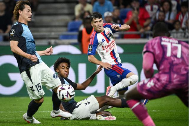 Lyon's Algerian forward #26 Kail Boudache (2nd R) fights for the ball with Le Havre's French defender #33 Djibril Ouziad (2nd L) during the French L1 football match between Olympique Lyonnais (OL) and Le Havre AC (HAC) at the Groupama Stadium in Decines-Charpieu, central-eastern France on August 29, 2026. (Photo by ARNAUD FINISTRE / AFP)