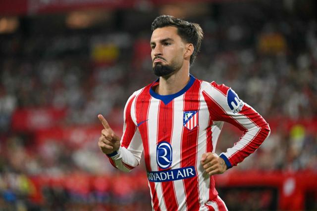 Atletico Madrid's Spanish forward #10 Alex Baena celebrates scoring his team's first goal during the Spanish league football match between Sevilla FC and Club Atletico de Madrid at the Ramon Sanchez Pizjuan stadium in Seville on August 29, 2026. (Photo by JORGE GUERRERO / AFP)