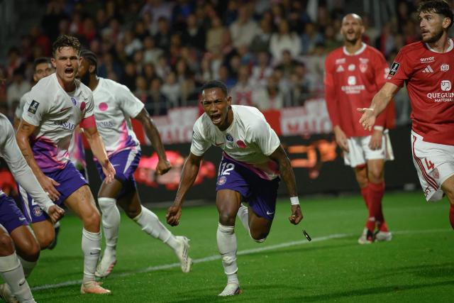 Toulouse's Ivorian defender #12 Christ Tape (C) celebrates after scoring his team's second goal during the French L1 football match between Stade Brestois 29 and Toulouse Football Club at the Francis Le Ble stadium in Brest, western France on August 29, 2026. (Photo by Loic VENANCE / AFP)