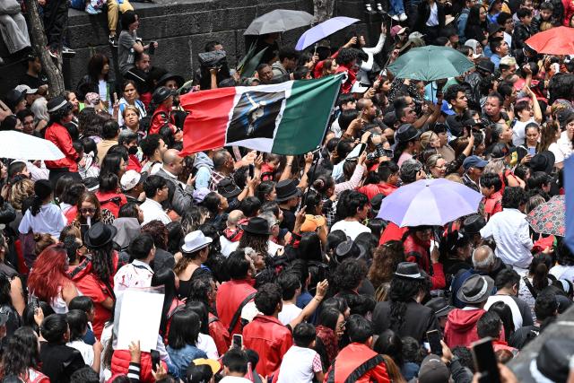 Mexican fans of the late "King of Pop" Michael Jackson perform during the annual event dubbed "I Do Dance to Thriller", held to mark the anniversary of the singer's birth, on the esplanade of the Monument to the Revolution in Mexico City on August 29, 2026. (Photo by Yuri CORTEZ / AFP)