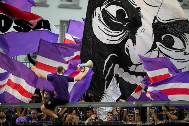 Toulouse's supporters cheer for their team during the French L1 football match between Stade Brestois 29 and Toulouse Football Club at the Francis Le Ble stadium in Brest, western France on August 29, 2026. (Photo by Loic VENANCE / AFP)