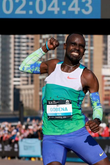 Ethiopia's Addisu Gobena celebrates as he crosses the finish line to win the 2026 Sydney Marathon in Sydney on August 30, 2026. (Photo by DAVID GRAY / AFP)