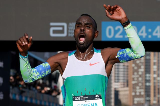 Ethiopia's Addisu Gobena celebrates as he crosses the finish line to win the 2026 Sydney Marathon in Sydney on August 30, 2026. (Photo by DAVID GRAY / AFP)