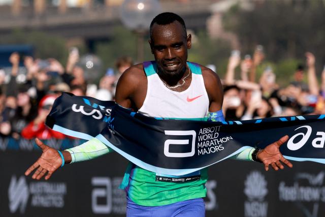 Ethiopia's Addisu Gobena celebrates as he crosses the finish line to win the 2026 Sydney Marathon in Sydney on August 30, 2026. (Photo by DAVID GRAY / AFP)