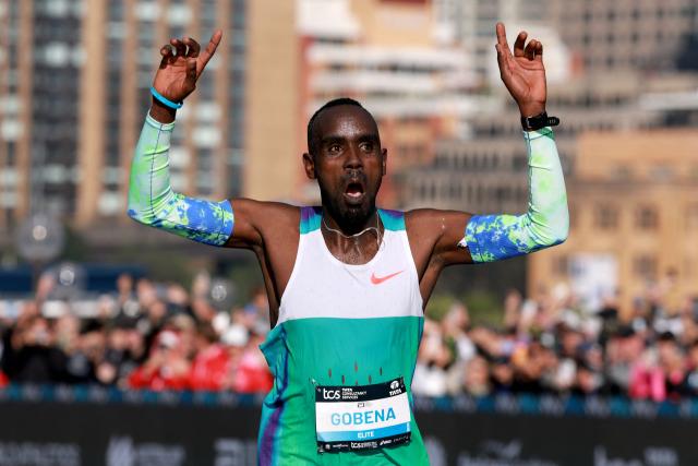 Ethiopia's Addisu Gobena celebrates as he crosses the finish line to win the 2026 Sydney Marathon in Sydney on August 30, 2026. (Photo by DAVID GRAY / AFP)