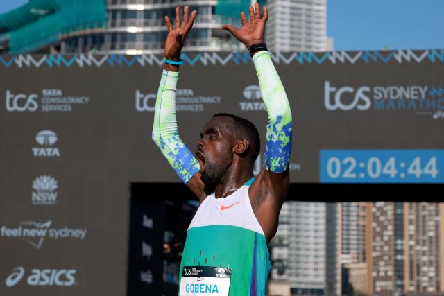 Ethiopia's Addisu Gobena celebrates as he crosses the finish line to win the 2026 Sydney Marathon in Sydney on August 30, 2026. (Photo by DAVID GRAY / AFP)