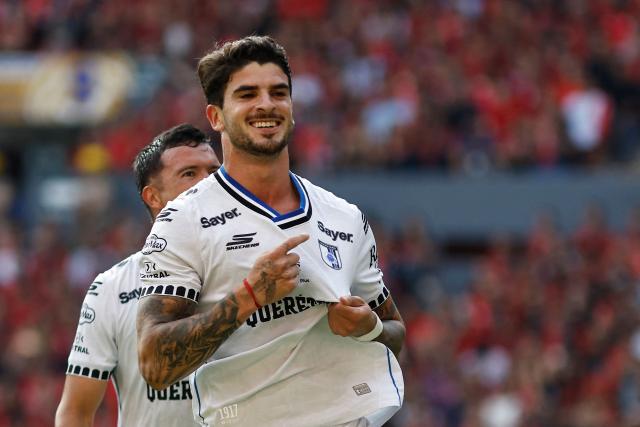 Queretaro's Uruguayan midfielder #05 Santiago Homenchenko celebrates after scoring a goal during the Liga MX Apertura tournament football match between Atlas and Queretaro, at the Jalisco stadium in Guadalajara, state of Jalisco, Mexico, on August 29, 2026. (Photo by ULISES RUIZ / AFP)