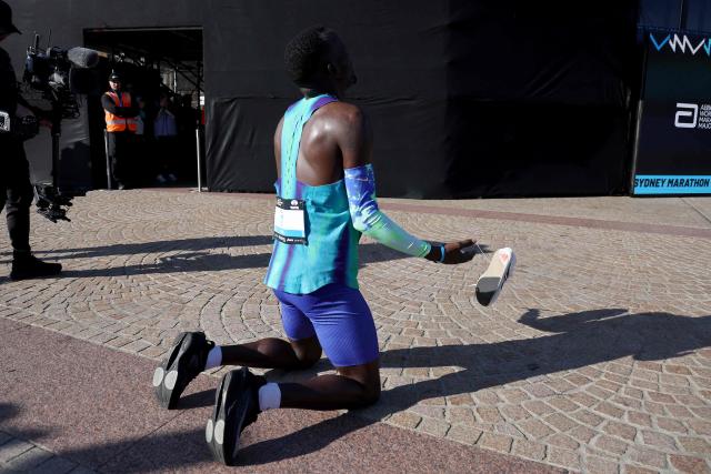 Ethiopia's Addisu Gobena reacts after crossing the finish line to win the 2026 Sydney Marathon in Sydney on August 30, 2026. (Photo by DAVID GRAY / AFP)