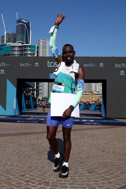 Ethiopia's Addisu Gobena reacts after crossing the finish line to win the 2026 Sydney Marathon in Sydney on August 30, 2026. (Photo by DAVID GRAY / AFP)