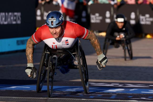 Britain’s David Weir reacts as he crosses the finish line to finish second in the Men’s wheelchair category of the 2026 Sydney Marathon in Sydney on August 30, 2026. (Photo by DAVID GRAY / AFP)