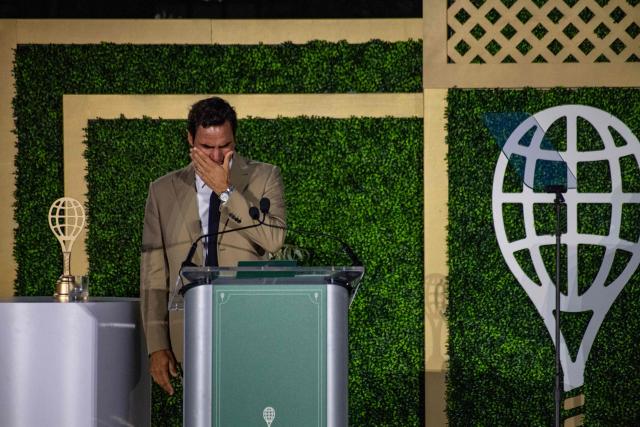 Swiss former tennis player Roger Federer accepts his induction into the International Tennis Hall of Fame during a ceremony in Newport, Rhode Island, on August 29, 2026. (Photo by Joseph Prezioso / AFP)