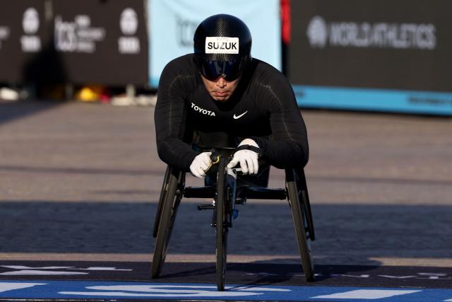 Japan’s Tomoki Suzuki reacts as he crosses the finish line to finish fourth in the men’s wheelchair category of the 2026 Sydney Marathon in Sydney on August 30, 2026. (Photo by DAVID GRAY / AFP)
