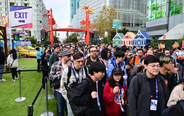 People attend the 2026 Pokemon World Championships and Pokemon XP at the Moscone Center in San Francisco, California on August 29, 2026. More than 50,000 fans are expected to be in attendance for the 3-day event from August 28-30 as the Pokemon World Championships return to San Francisco for the first time in a decade and for Pokemon XP, the first fan convention of its kind. The Pokemon franchise has an estimated global revenue of over $147 billion since launching in 1996, making it the world's most valuable media franchise. (Photo by Frederic J. BROWN / AFP)