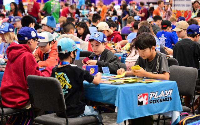 Pokemon trainers compete in the Trading Card Game (TCG) competition during the 2026 Pokemon World Championships and Pokemon XP at the Moscone Center in San Francisco, California on August 29, 2026. More than 50,000 fans are expected to be in attendance for the 3-day event from August 28-30 as the Pokemon World Championships return to San Francisco for the first time in a decade and for Pokemon XP, the first fan convention of its kind. The Pokemon franchise has an estimated global revenue of over $147 billion since launching in 1996, making it the world's most valuable media franchise. (Photo by Frederic J. BROWN / AFP)