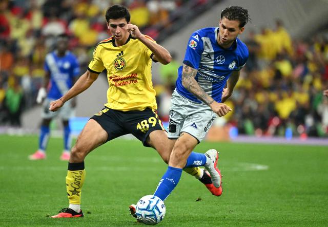 America's forward #189 Alejandro Cardenas and Puebla's Costa Rican defender #04 Juan Pablo Vargas fight for the ball during the Liga MX Apertura tournament football match between America and Puebla, at Bannorte stadium in Mexico City on August 29, 2026. (Photo by YURI CORTEZ / AFP)