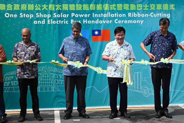 Palau President Surangel S. Whipps Jr. (2nd L) and Taiwan's Foreign Minister Lin Chia-lung (2nd R) cut a ribbon during the inauguration ceremony for Taiwan-funded solar energy and electric bus projects in Koror on August 30, 2026, ahead of the 55th Pacific Islands Forum Leaders Meeting. (Photo by SAEED KHAN / AFP)