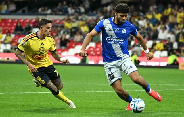 America's Uruguayan midfielder #07 Brian Rodriguez and Puebla's defender #20 Jose Pachuca fight for the ball during the Liga MX Apertura tournament football match between America and Puebla, at Bannorte stadium in Mexico City on August 29, 2026. (Photo by YURI CORTEZ / AFP)