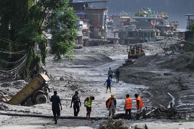 Rescue works continue at Trishuli Center in Nepal's Nuwakot district on August 30, 2026, after catastrophic flooding on the Nepal-Tibet border. The number of people missing in the catastrophic flood that sliced through the border area between Nepal and Tibet neared 3,000 on August 30, as rescuers scoured deep, leg-sucking mud for survivors. (Photo by Arun SANKAR / AFP)