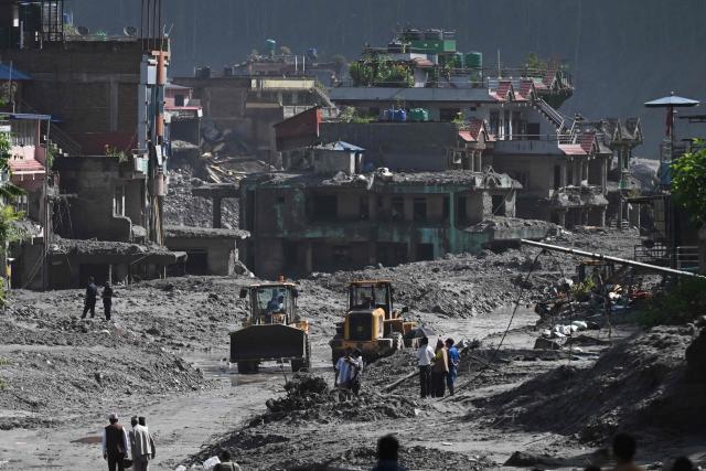 Rescue works continue at Trishuli Center in Nepal's Nuwakot district on August 30, 2026, after catastrophic flooding on the Nepal-Tibet border. The number of people missing in the catastrophic flood that sliced through the border area between Nepal and Tibet neared 3,000 on August 30, as rescuers scoured deep, leg-sucking mud for survivors. (Photo by Arun SANKAR / AFP)
