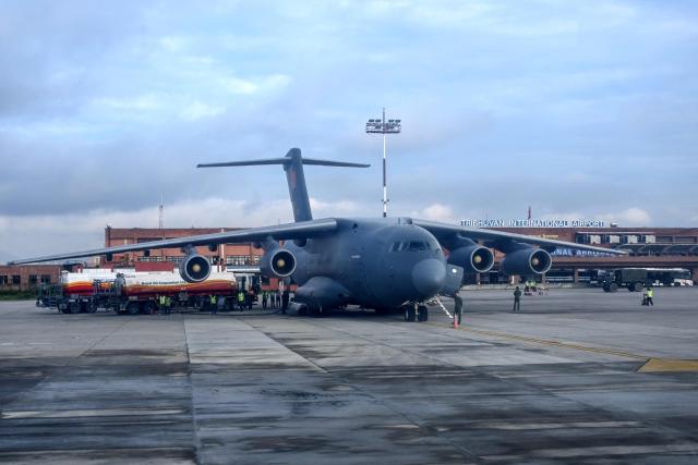 A Chinese military aircraft carrying relief aid is seen parked at the Tribhuvan International Airport in Kathmandu on August 30, 2026. The number of people missing in the catastrophic flood that sliced through the border area between Nepal and Tibet neared 3,000 on August 30, as rescuers scoured deep, leg-sucking mud for survivors. (Photo by Prakash MATHEMA / AFP)