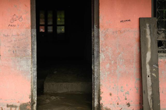 The names of Argentinian football player Messi and Brazil's Neymar are seen on a wall of a classroom covered heavily in mud in the aftermath of flash floods at the Bageshwori secondary school in Galchi town of Nepal's Dhading district on August 30, 2026. The number of people missing in the catastrophic flood that sliced through the border area between Nepal and Tibet exceeded 3,000 on August 30, as rescuers scoured deep, leg-sucking mud for survivors. (Photo by Manan VATSYAYANA / AFP)