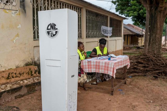 Electoral officials wait for voters at a voting station during Guinea-Bissau's constitutional referendum in Bissau, on August 30 2026. Voters in military-run Guinea-Bissau cast their ballots on August 30 in a referendum that could give the president more powers ahead of a general election meant to restore civilian rule later this year. Voting got off to a slow start in some neighbourhoods when polls opened at 0700 GMT, AFP correspondents said, after a heavy early morning downpour. (Photo by Samba BALDE / AFP)