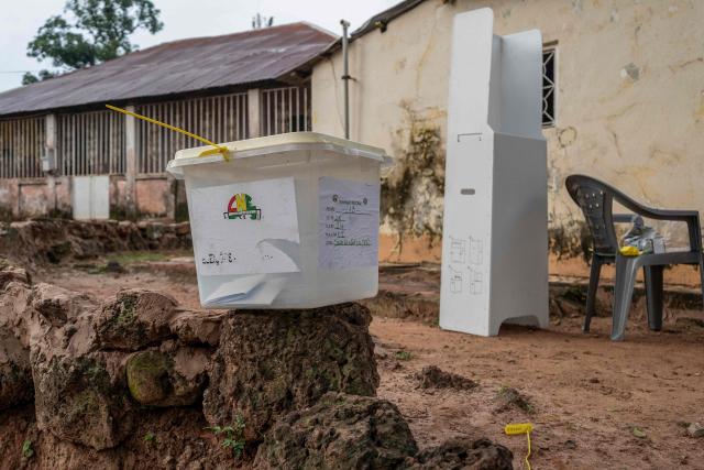 A general view of a ballot box and a voting booth at a voting station during Guinea-Bissau's constitutional referendum in Bissau, on August 30 2026. Voters in military-run Guinea-Bissau cast their ballots on August 30 in a referendum that could give the president more powers ahead of a general election meant to restore civilian rule later this year. Voting got off to a slow start in some neighbourhoods when polls opened at 0700 GMT, AFP correspondents said, after a heavy early morning downpour. (Photo by Samba BALDE / AFP)