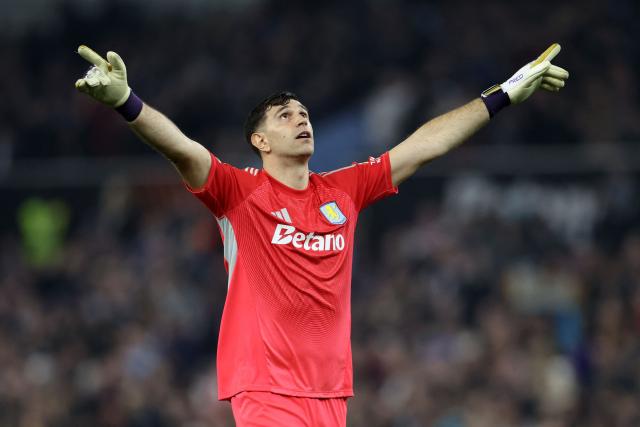 (FILES) Aston Villa's Argentinian goalkeeper #23 Emiliano Martínez celebrates his team's second goal during the UEFA Europa League, round of 16 second-leg football match between Aston Villa and Lille LOSC at Villa Park in Birmingham, central England on March 19, 2026. Argentina's 2022 World Cup winning  goalkeeper Emiliano Martinez has joined Chelsea from fellow Premier League outfit Aston Villa, the London-based club announced Sunday, August 30. (Photo by Darren Staples / AFP)