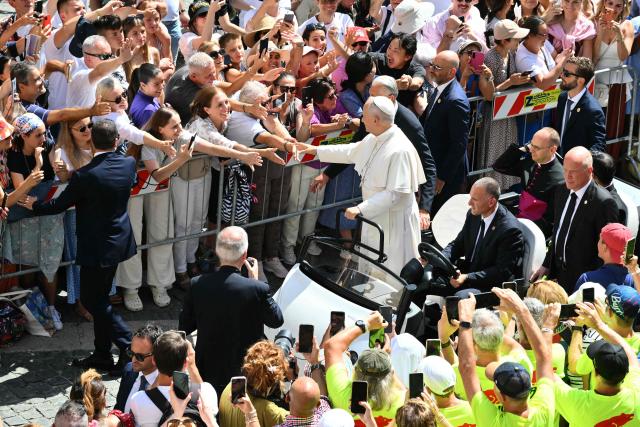 Pope Leo XIV greets the crowd after the Angelus prayer from the entrance of the Apostolic Palace in Piazza della Liberta (Liberty Square) at the summer papal residence in Castel Gandolfo on August 30, 2026. (Photo by Alberto PIZZOLI / AFP)
