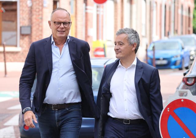 Candidate in France’s 2027 presidential election for the right-wing party Horizons and Mayor of Le Havre Edouard Philippe (L) and Justice Minister Gerald Darmanin walk on a street during a visit in Tourcoing for the kickoff of Darmanin's political season on August 30, 2026. (Photo by Francois LO PRESTI / AFP)