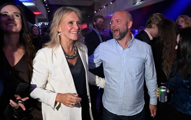 Iceland's Foreign Minister Thorgerdur Katrin Gunnarsdottir (L) reacts alongside a supporter as early results are announced during the “Yes” campaign's referendum night event in Reykjavik, Iceland, on August 30, 2026. Iceland voted 'No' to resuming membership negotiations with the European Union, final referendum results showed on August 30, dealing a heavy blow to Brussels which had been keen to welcome a new wealthy member. The 'No' camp emerged victorious with 52.8 percent of votes, while the 'Yes' camp garnered 47.2 percent, the official count published by public broadcaster RUV showed. (Photo by Halldor KOLBEINS / AFP)