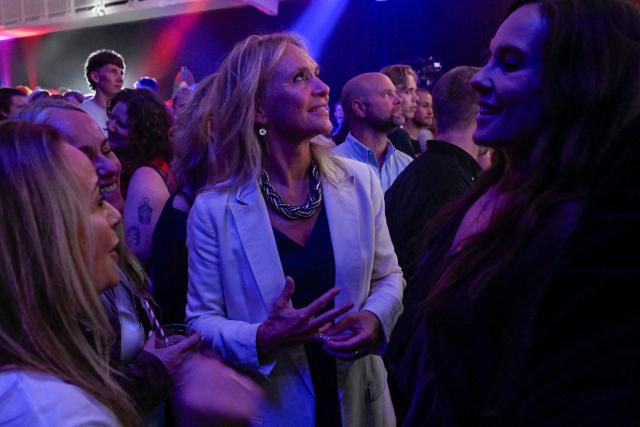 Iceland's Foreign Minister Thorgerdur Katrin Gunnarsdottir (C) watches alongside supporters as early results are awaited during the “Yes” campaign's referendum night event in Reykjavik, Iceland, on August 30, 2026. Iceland voted 'No' to resuming membership negotiations with the European Union, final referendum results showed on August 30, dealing a heavy blow to Brussels which had been keen to welcome a new wealthy member. The 'No' camp emerged victorious with 52.8 percent of votes, while the 'Yes' camp garnered 47.2 percent, the official count published by public broadcaster RUV showed. (Photo by Halldor KOLBEINS / AFP)