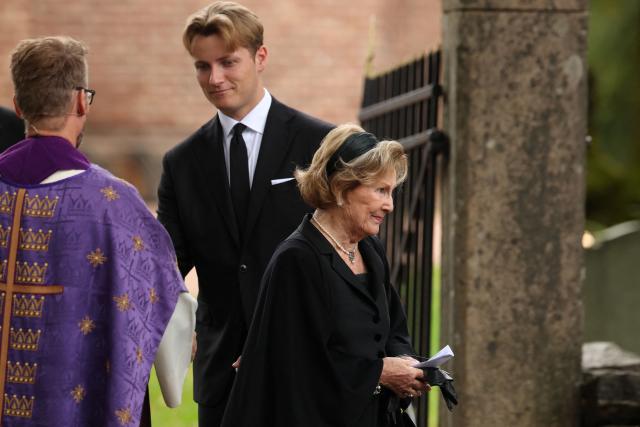 Norway's Queen Sonja (R) leaves Asker Church as Prince Sverre Magnus (C) shakes hands with Dean Oyvind Stabrun (L), after attending a memorial church service for the late King Harald V in Asker, Norway, on August 30, 2026. King Harald V of Norway, who died on August 28, 2026 aged 89, remained a unifying figure in his country until the very end, a pillar of stability amid a string of family scandals that tarnished the final years of his reign. (Photo by Odd ANDERSEN / AFP)