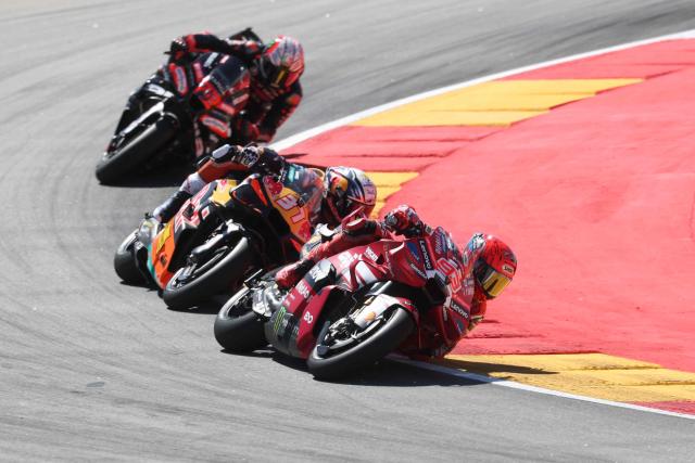 Team Ducati Lenovo Team's Marc Marquez rides ahead of Team Red Bull KTM Factory Racing's Pedro Acosta and Team Aprilia Racing's Marco Bezzecchi in the MotoGP race during the Aragon MotoGP Grand Prix at the Motorland circuit in Alcaniz, northeastern Spain, on August 30, 2026. (Photo by Pierre-Philippe MARCOU / AFP)