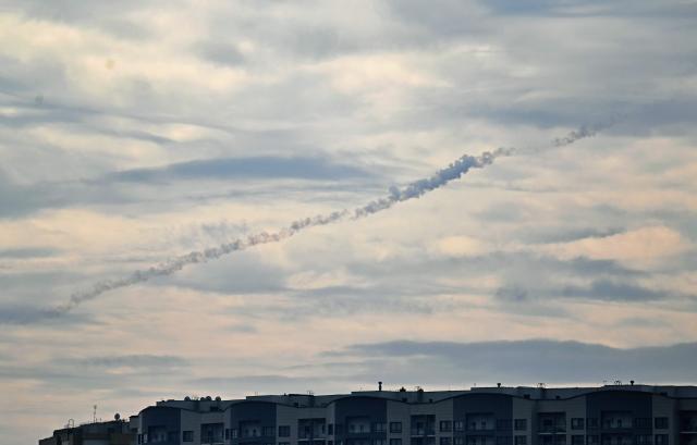 This photograph shows smoke in the sky after Ukrainian air defence fired at Russian drone above Kyiv during a Russian drone strike on the Ukrainian capital on August 30, 2026, amid the Russian invasion of Ukraine. (Photo by Sergei SUPINSKY / AFP)