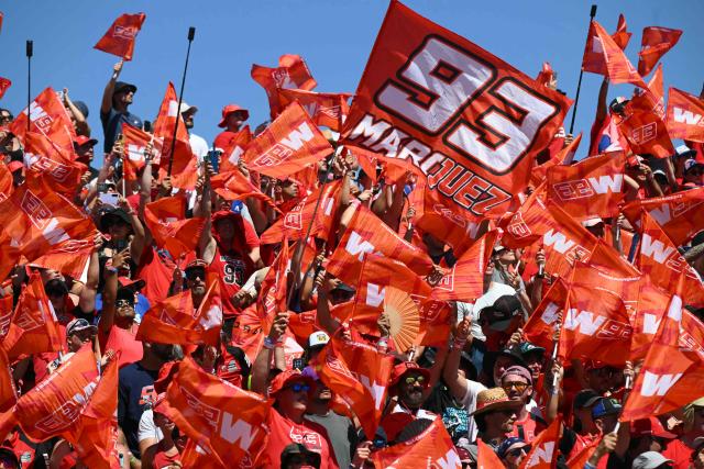 Fans of Team Ducati Lenovo Team's Marc Marquez celebrate his victory in the MotoGP race during the Aragon MotoGP Grand Prix at the Motorland circuit in Alcaniz, northeastern Spain, on August 30, 2026. (Photo by JOSE JORDAN / AFP)