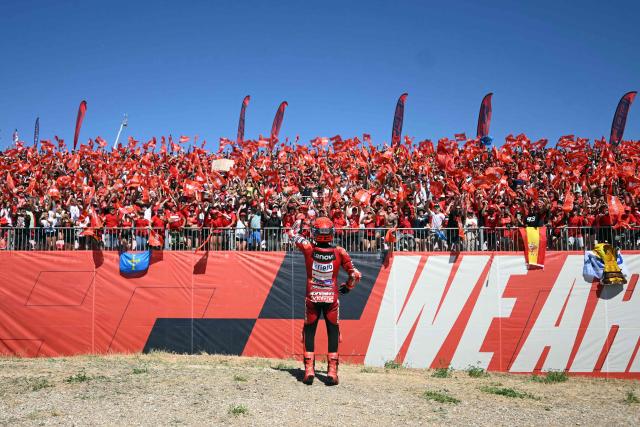 Team Ducati Lenovo Team's Marc Marquez celebrates winning the MotoGP race during the Aragon MotoGP Grand Prix at the Motorland circuit in Alcaniz, northeastern Spain, on August 30, 2026. Marc Marquez claimed a dominant victory at the Aragon MotoGP today, with Pedro Acosta finishing second and Marco Bezzecchi third. Seven-time MotoGP champion Marquez has a strong record at the MotorLand circuit and climbed to second in the overall standings behind Jorge Martin, who came fifth. (Photo by JOSE JORDAN / AFP)