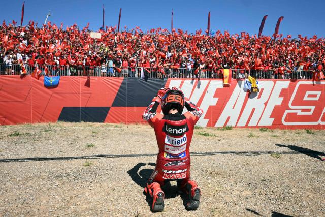 Team Ducati Lenovo Team's Marc Marquez celebrates winning the MotoGP race during the Aragon MotoGP Grand Prix at the Motorland circuit in Alcaniz, northeastern Spain, on August 30, 2026. Marc Marquez claimed a dominant victory at the Aragon MotoGP today, with Pedro Acosta finishing second and Marco Bezzecchi third. Seven-time MotoGP champion Marquez has a strong record at the MotorLand circuit and climbed to second in the overall standings behind Jorge Martin, who came fifth. (Photo by JOSE JORDAN / AFP)