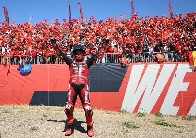 Team Ducati Lenovo Team's Marc Marquez celebrates winning the MotoGP race during the Aragon MotoGP Grand Prix at the Motorland circuit in Alcaniz, northeastern Spain, on August 30, 2026. Marc Marquez claimed a dominant victory at the Aragon MotoGP today, with Pedro Acosta finishing second and Marco Bezzecchi third. Seven-time MotoGP champion Marquez has a strong record at the MotorLand circuit and climbed to second in the overall standings behind Jorge Martin, who came fifth. (Photo by JOSE JORDAN / AFP)