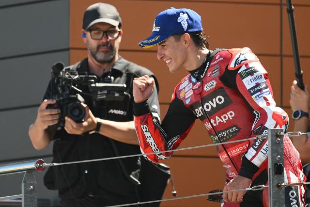 Team Ducati Lenovo Team's Marc Marquez celebrates on the podium after winning the MotoGP race of the Aragon MotoGP Grand Prix at the Motorland circuit in Alcaniz, northeastern Spain, on August 30, 2026. (Photo by JOSE JORDAN / AFP)