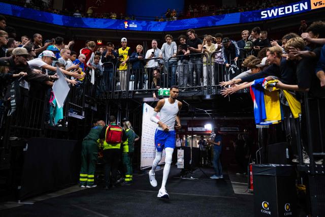 TOPSHOT - France's power forward #32 Victor Wembanyama arrives on the pitch prior to the FIBA 2027 World Cup qualifying basketball match, 2nd round Group L, between Sweden and France at Avicii Arena in Stockholm, on August 30, 2026. (Photo by Jonathan NACKSTRAND / AFP)