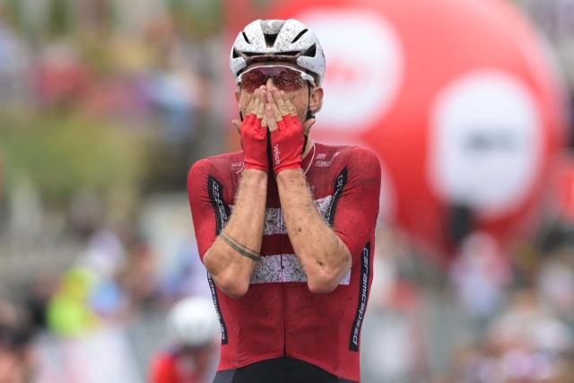 Danish rider Mads Wurtz Schmidt celebrates as he crosses the finish line to win the UEC Gravel European Championships in Houffalize on August 30, 2026. (Photo by DAVID PINTENS / Belga / AFP) / Belgium OUT