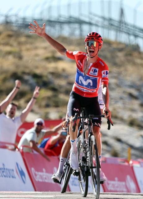 Team Movistar's Spanish rider Enric Mas celebrates winning the 9th stage of the Vuelta a Espana 2026 cycling tour, a 187,4 km race between Villajoyosa and Alto de Aitana in Confrides, on August 30, 2026. (Photo by Josep LAGO / AFP)