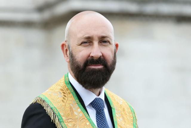 Newly elected Grand Master of the Freemasonic organization The Grand Orient de France (GODF) Guillaume Trichard poses for a picture prior to pay his respects on the tomb of the Unknown Soldier under the Arc de Triomphe Monument in Paris on August 30, 2026. (Photo by Thomas SAMSON / AFP)